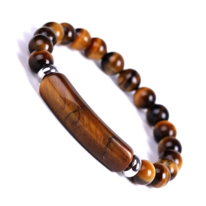 Macro view of brown tiger eye stone bracelet with rectangular focal bead and silver spacers