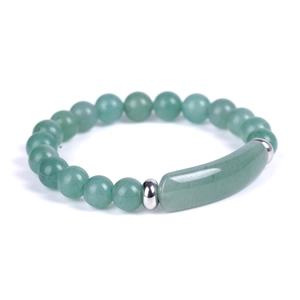 Macro shot of green aventurine stone beads with polished stainless steel spacers
