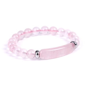Detail of pink crystal beaded bracelet with curved gemstone bar and silver spacers