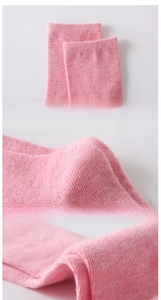 Detail view of pink cotton socks featuring ribbed cuffs and 3D heel construction
