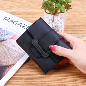 Minimalist black three-fold wallet for women with drawstring and snap button closure