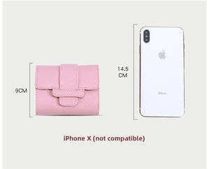 Pink tri-fold wallet detail showing its 9cm height compared to an iPhone X for size