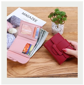 Detail view of tri-fold wallet interior featuring multiple card slots and cash compartment
