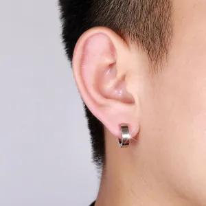 Polished steel hoop earring for men and women shown on a model with minimalist design