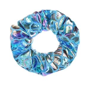 Close-up of blue mermaid scale pattern hair scrunchie with metallic glitter finish