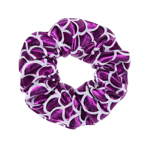 Detail of purple satin scrunchie with white fish scale pattern and glossy texture