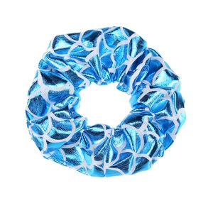Detailed view of blue fish scale pattern scrunchie made of shiny fabric texture
