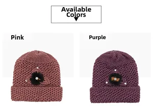 Detail view of pink and purple knitted winter beanies with floral rhinestone accents