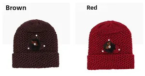 Close-up of brown and red knitted winter hats with rhinestone fur floral details