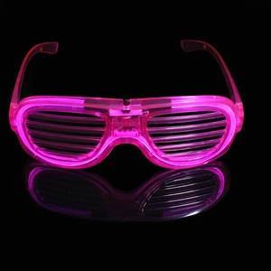 Close-up of pink LED shutter glasses with reflection on a dark surface for party events