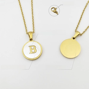 Detail of gold letter B pendant with white shell inlay and lobster clasp on fine chain
