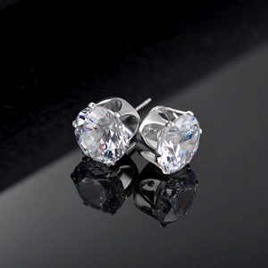 Pair of silver stud earrings with round-cut sparkling cubic zirconia in four-prong setting