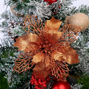 Close-up of a bronze glitter Christmas flower ornament on a decorated festive tree