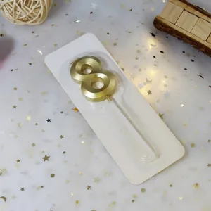 Detailed view of golden number 8 candle in blister pack showing 5cm height and metallic finish