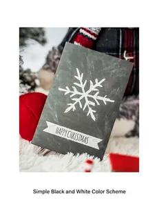 Close-up of a dark grey Christmas card with white hand-drawn snowflakes and festive texture