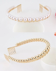 Detailed macro view of gold-plated hair combs with faux pearls and metallic bead accents