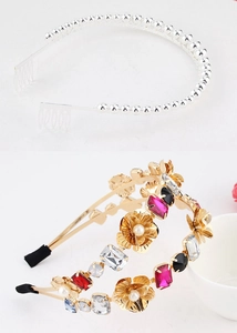 Detail of metal headband with rhinestone flowers, pearls, and anti-slip comb base