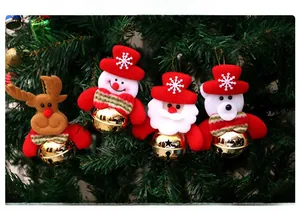 Detail of plush Christmas tree ornaments with reindeer and Santa figures and gold bells