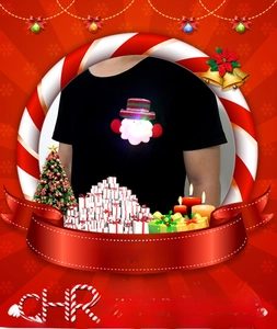 Glow-in-the-dark Santa Claus brooch with LED lights pinned to a black shirt