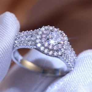 Luxury silver bridal ring with large round crystal and pink diamond halo sparkle