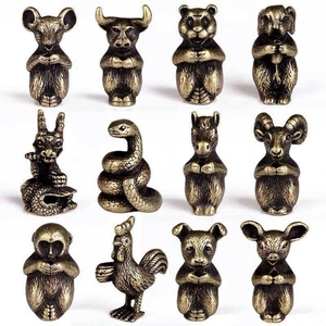 Macro shot of twelve zodiac figurines made of antique copper alloy for incense holders