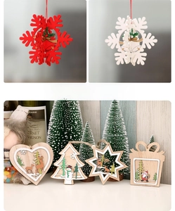 Detailed view of layered wooden Christmas tree ornaments with laser-cut festive patterns