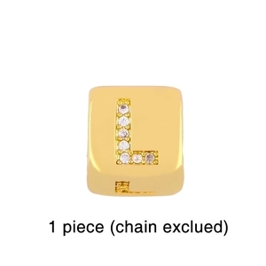 Detail of gold square pendant with rhinestone letter L for DIY bracelet jewelry