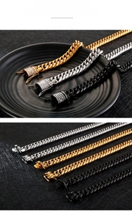 Detail of polished stainless steel Cuban link chains in gold, silver and black finishes