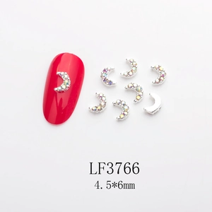 Detail of moon-shaped nail charms with AB rhinestones on silver metal base, 4.5*6mm size