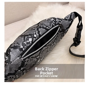 Detail showing the back zipper pocket and snake skin texture of this waist bag