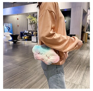 Cloud-shaped plush crossbody bag with gradient pink blue fur and golden chain strap