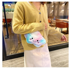 Detail of pink and blue gradient plush cloud bag with cute embroidery and metal chain strap