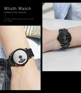 Minimalist quartz watch detail showing unique rotating disc hour and minute display