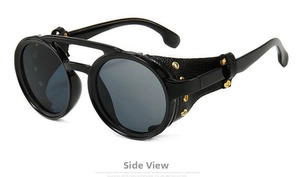 Detail view of retro steampunk sunglasses featuring leather side shields and gold rivets