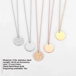 Detail showing 316L stainless steel necklaces with 13mm hammered and mirror pendants