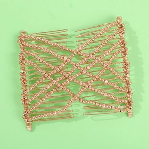 Golden beaded magic hair comb with double side metal teeth on light green background