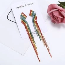 Close-up of rainbow rhinestone tassel earrings with multi-color gradient and S925 silver needles
