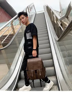 Sac à dos vintage en similicuir marron avec boucles et grande capacité pour hommes
