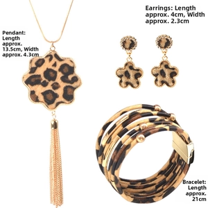 Detailed view of leopard print jewelry set with necklace, floral earrings and bracelet