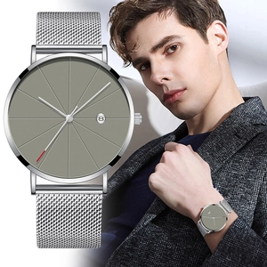 Men's silver mesh quartz watch with grey minimalist dial and date display on wrist