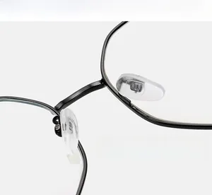 Macro detail of soft silicone nose pads on black metal glasses frame for comfort