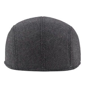 Classic herringbone newsboy cap in black and grey tweed fabric for autumn winter style