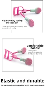 Detail view of pink metal eyelash curler with gradient handles and flower decorations