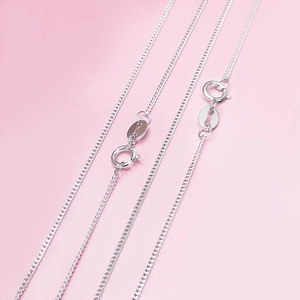 Minimalist S925 sterling silver curb chain necklace for women on pink background