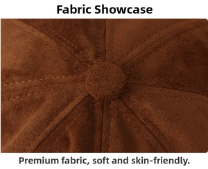 Macro shot of brown suede fabric texture with top button and stitched seam details