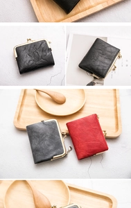 Detail of vintage matte leather wallets with retro metal clasps in various colors