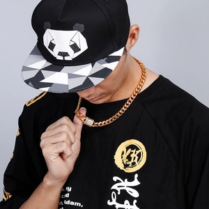 Golden Cuban link necklace for men with rhinestone dragon head buckle on a male model