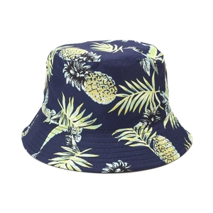 Navy blue cotton bucket hat with yellow pineapple prints and tropical palm leaf patterns