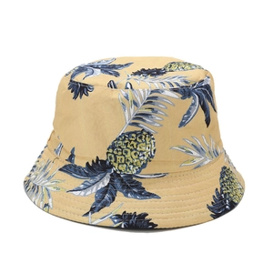 Yellow cotton bucket hat with blue tropical pineapple patterns for outdoor sun protection