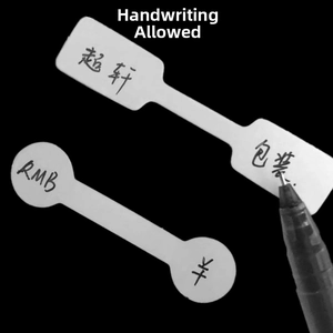 Macro view of white matte self-adhesive jewelry price tags for rings with handwritten text